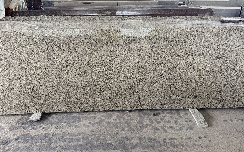 Ivory Brown polished granite slab